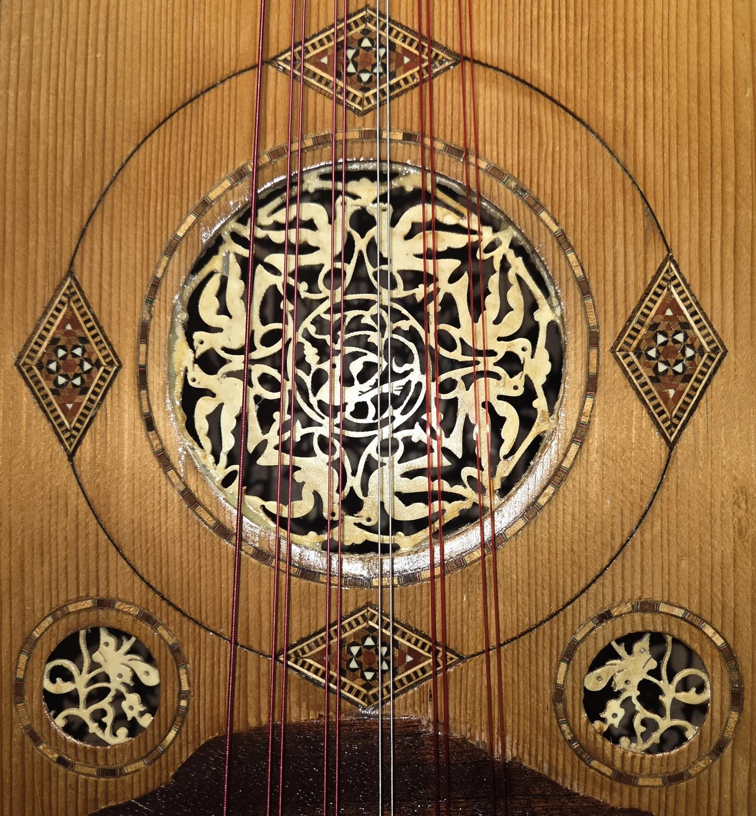 La Primera · carved bone shamsa rosettes and mosaic inlay